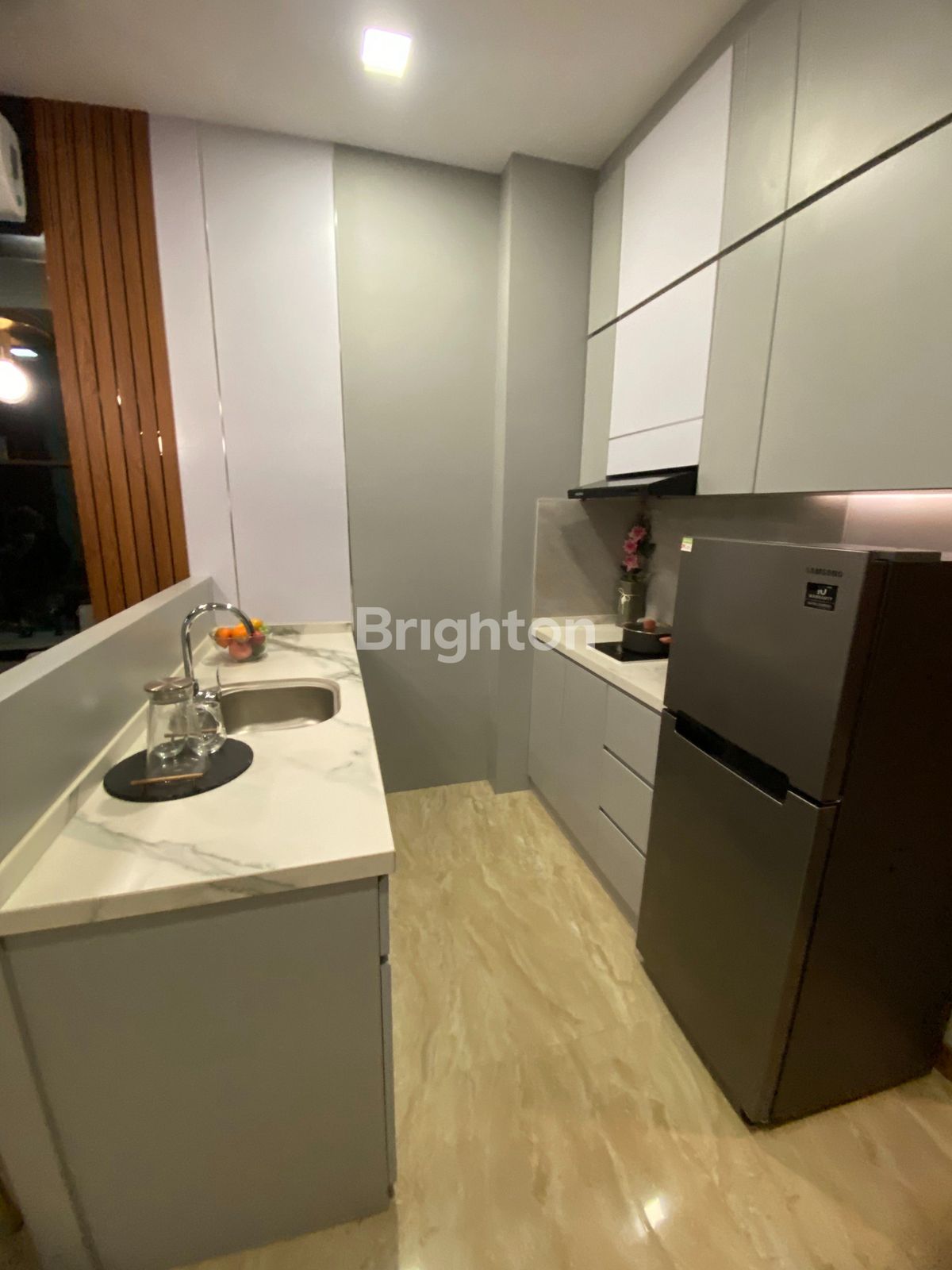 Kitchen set and fridge in Nagoya Hill Condominium Batam