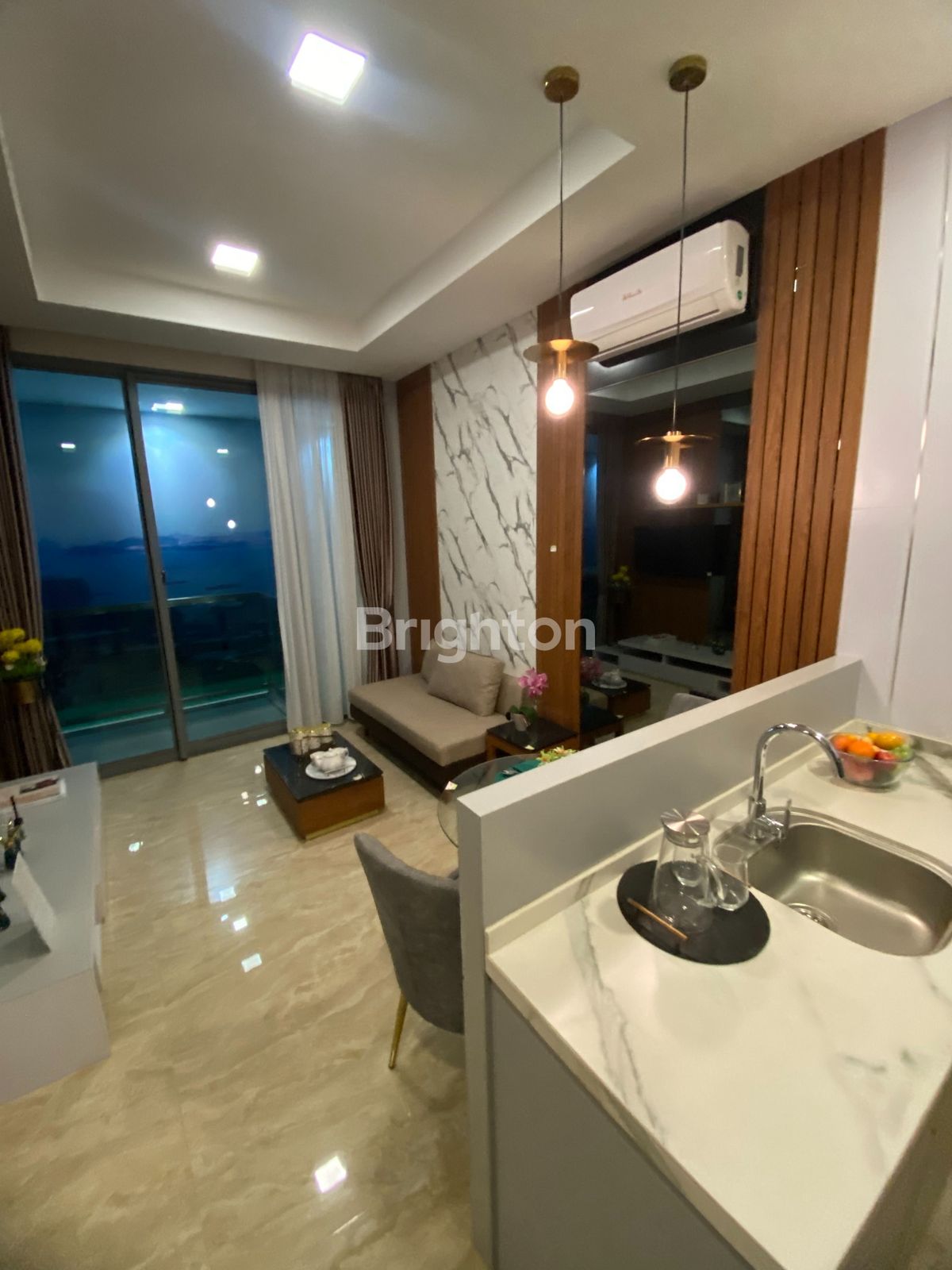 Living area with glass doors, 1-bedroom condo Nagoya Hill Batam
