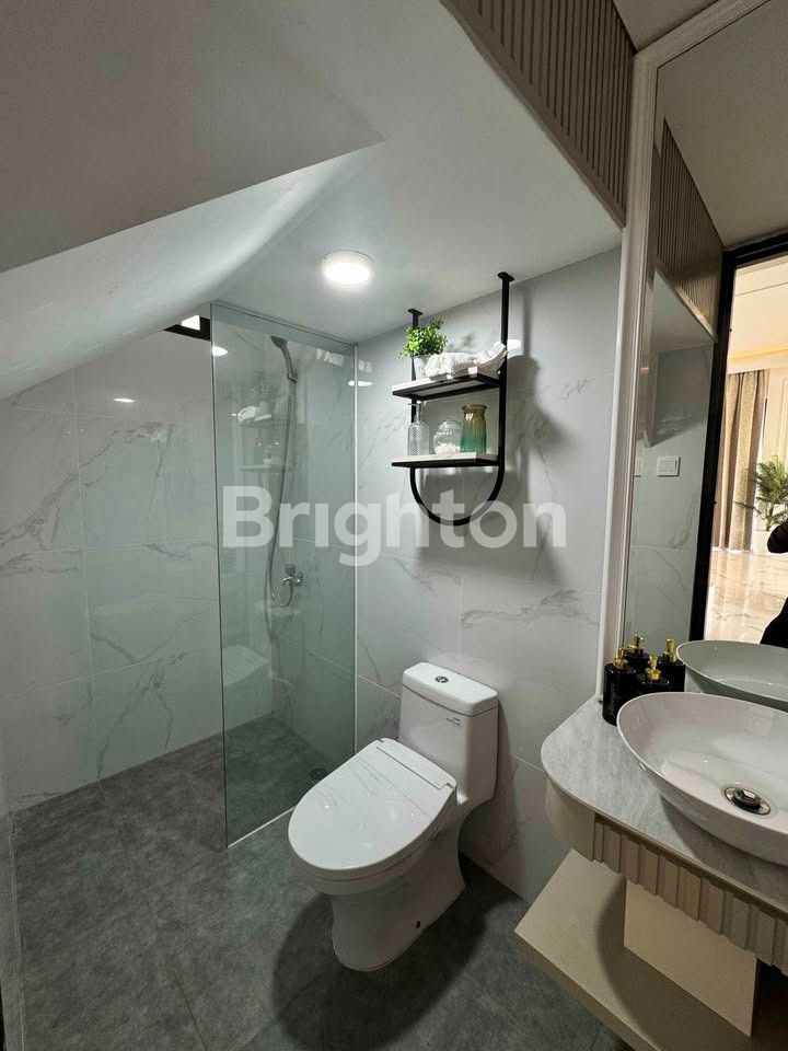 Ruang keluarga rumah Emerald Hills Citraland Batam