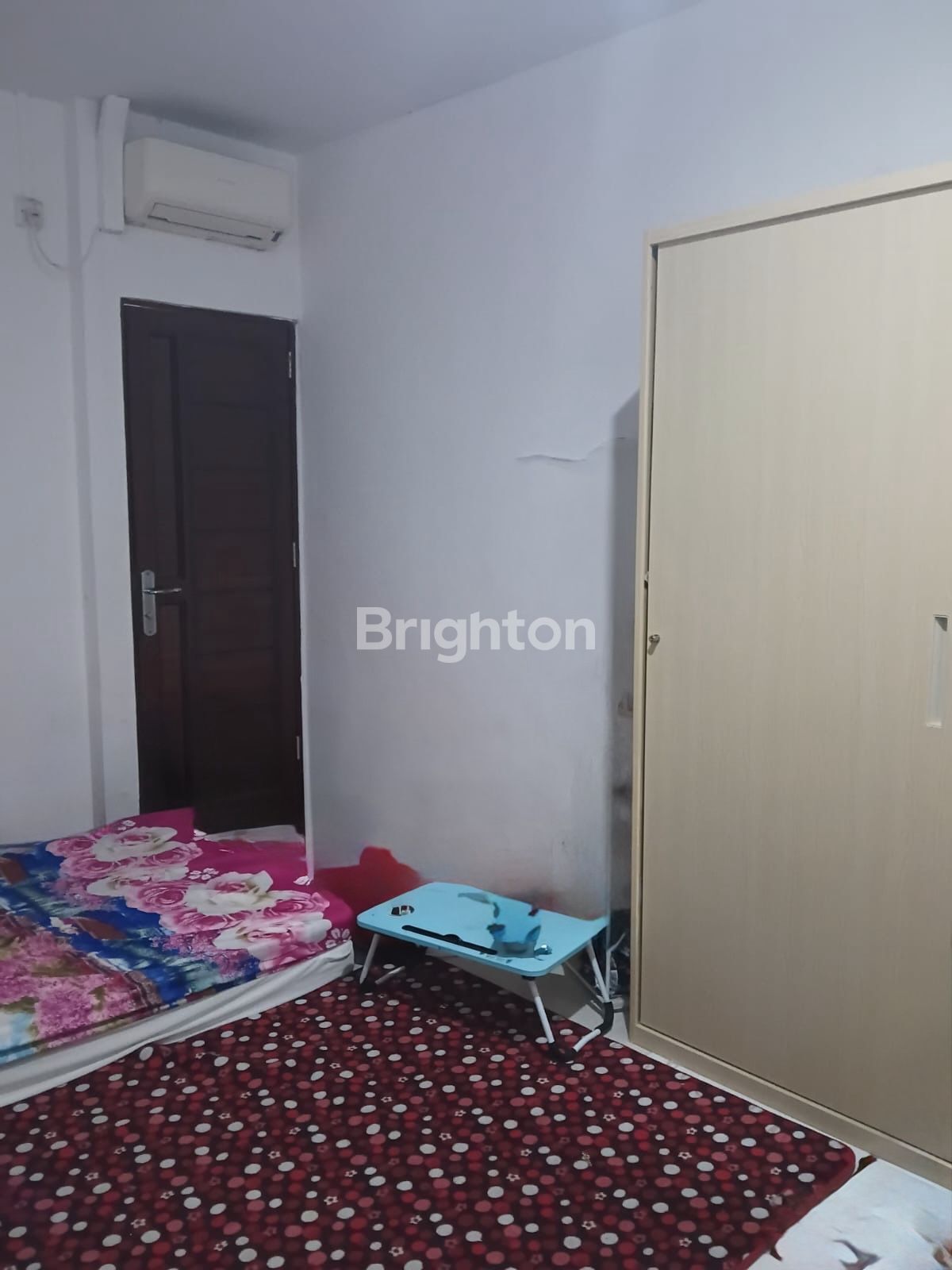 Air-conditioned bedroom interior of the house in Taman KDA, Batam