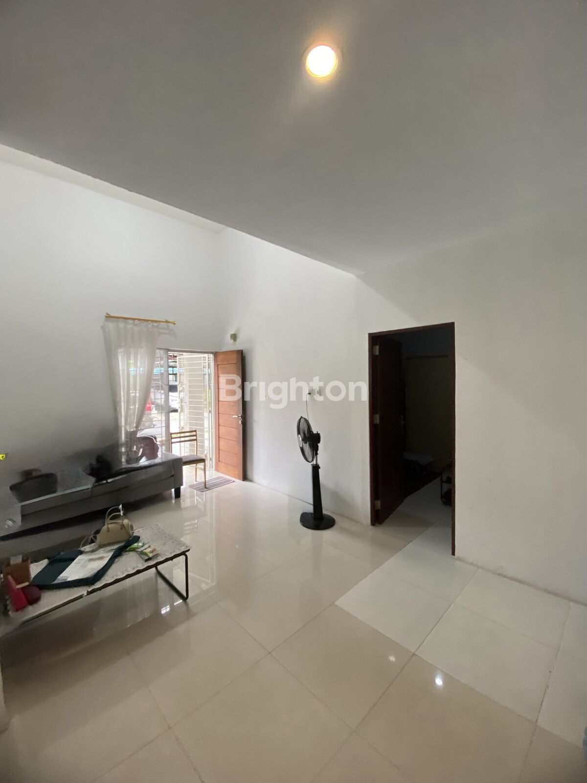 Bathroom with fitted bathtub and water heater at Taman KDA Batam Centre Batam